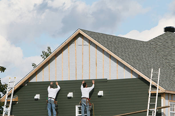 Professional Storm Damage Siding Repair technician working in Avon, PA